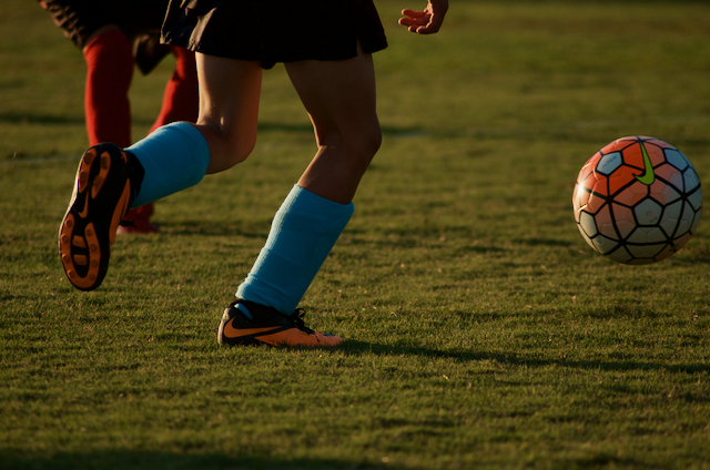 Child kicking a soccer ball